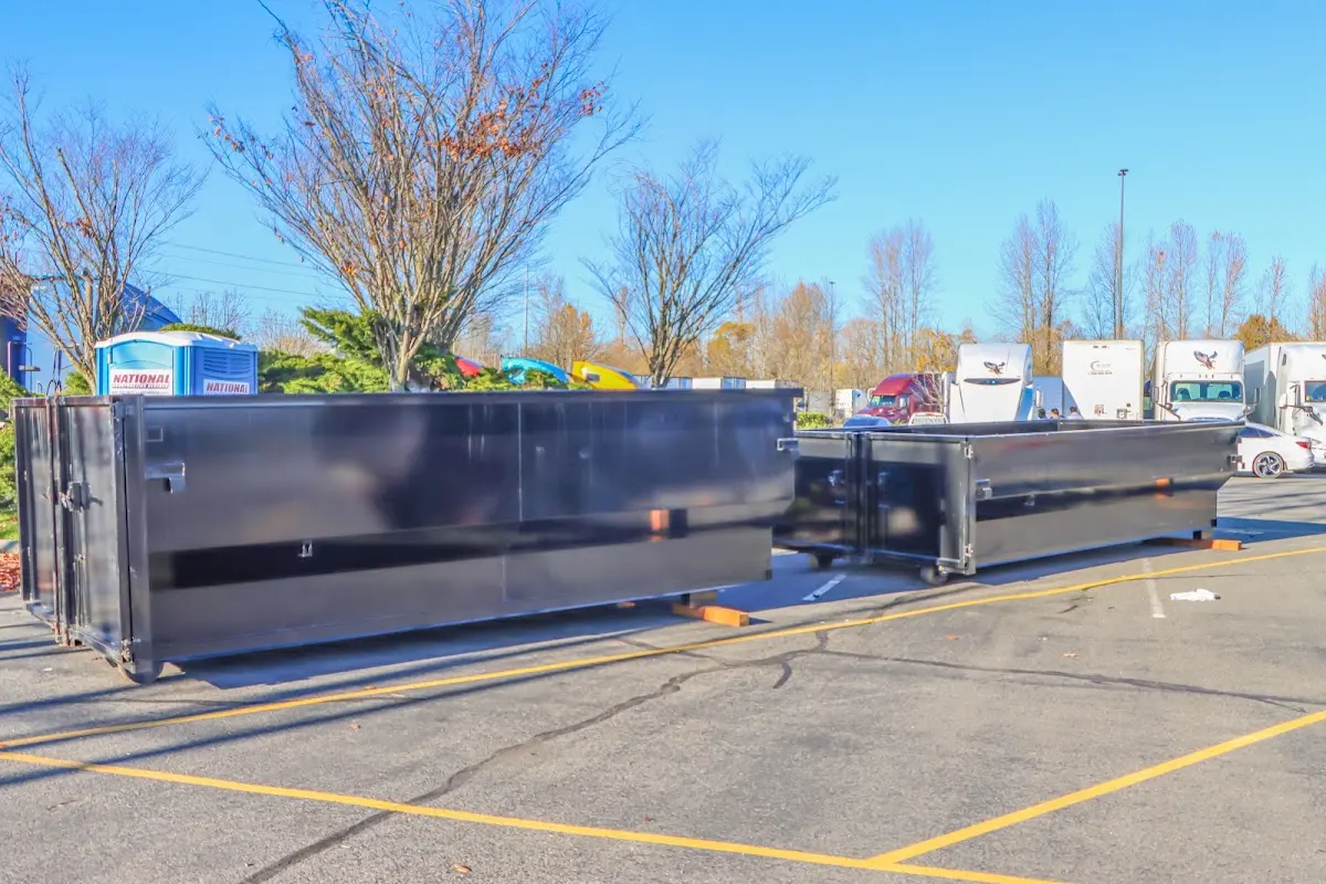 Professional dumpster rental service with roll-off container on residential driveway in Lugoff